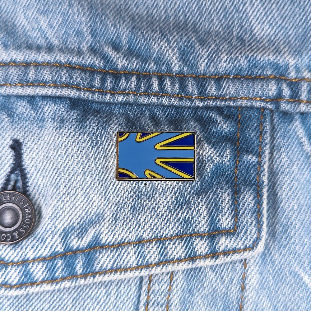 An image of a deaf pin on a denim jacket pocket