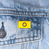 An image of a Intersex pin on a denim jacket pocket